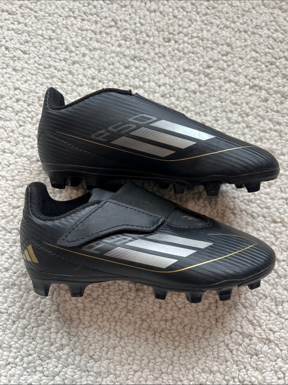 adidas Kids Black Soccer Cleats with Silver & Gold Accents